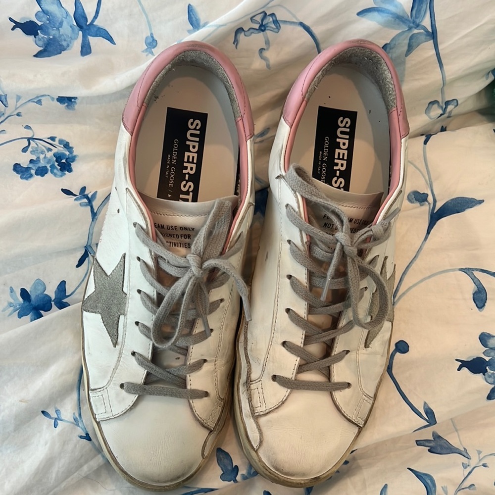 white and pink golden goose sneakers